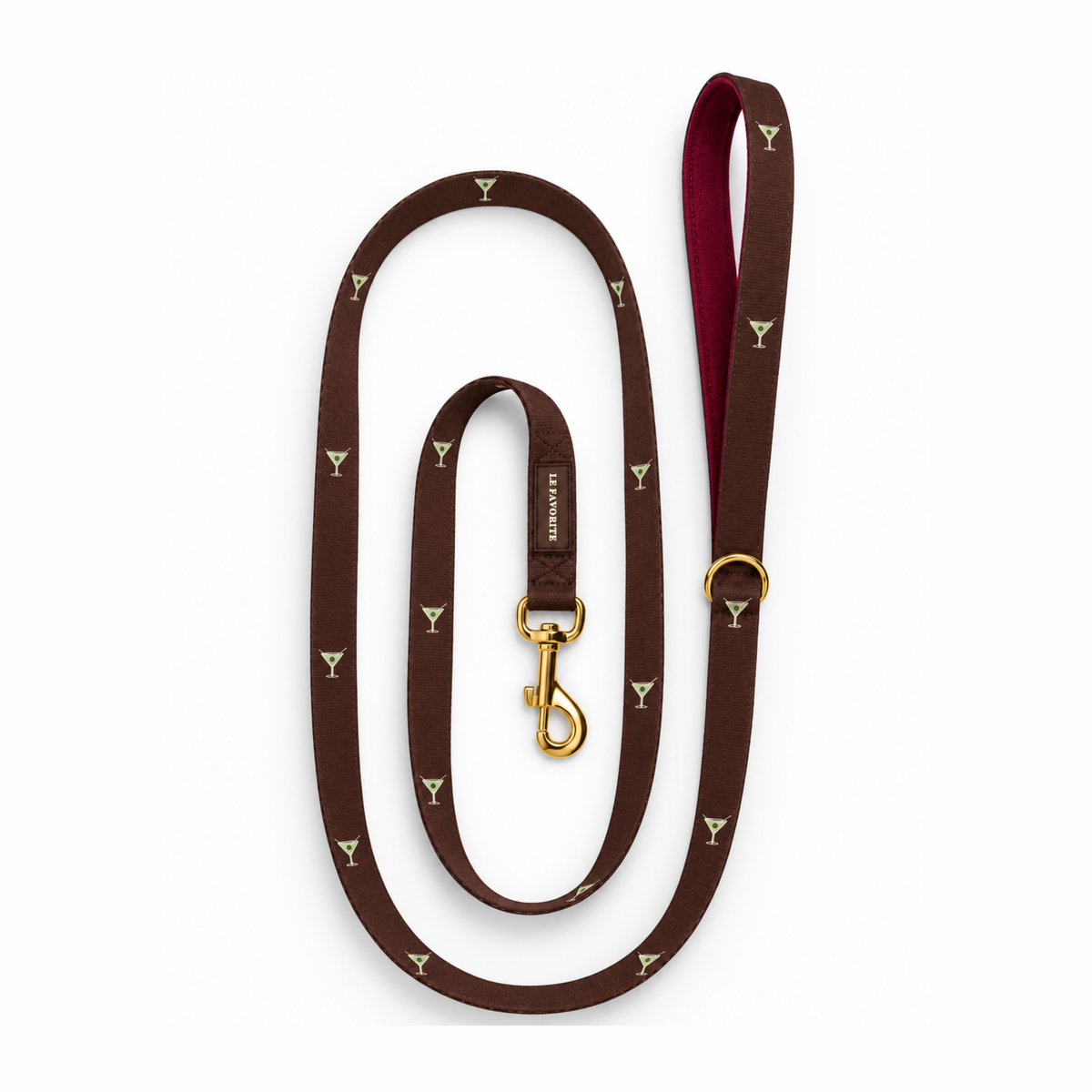 A dark brown leather dog leash with a repeating small yellow cocktail glass pattern, a burgundy inner lining, and gold-tone hardware, including a swivel clasp and a metal ring.